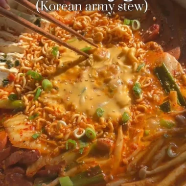 Budae Jjigae, traditional Korean army stew with noodles, sausage, and vegetables.