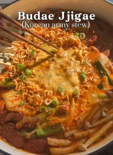 Budae Jjigae, traditional Korean army stew with noodles, sausage, and vegetables.