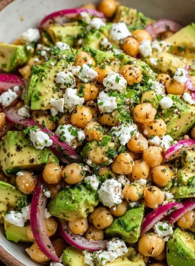 Chickpea Feta Avocado Salad with fresh ingredients in a bowl