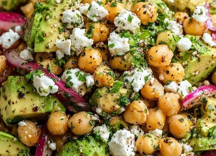 Chickpea Feta Avocado Salad with fresh ingredients in a bowl