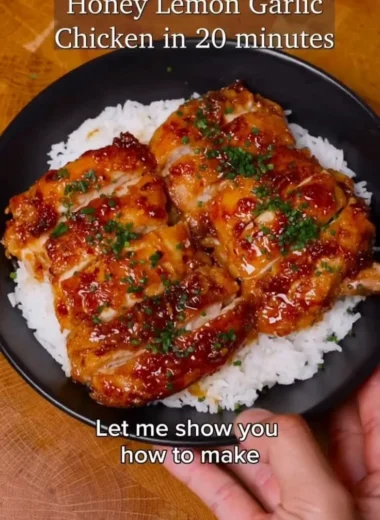 Delicious Honey Lemon Garlic Chicken served on a plate with fresh herbs