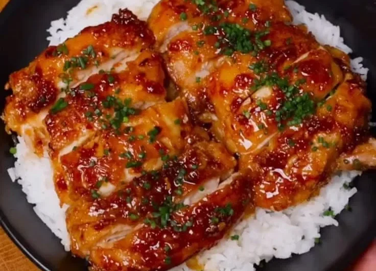 Delicious Honey Lemon Garlic Chicken served on a plate with fresh herbs