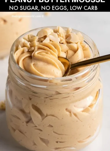 Delicious Keto Peanut Butter Mousse served in a bowl, topped with whipped cream.