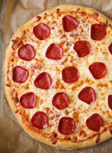 Delicious Pepperoni Pizza with extra cheese and fresh basil