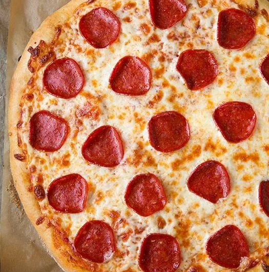 Delicious Pepperoni Pizza with extra cheese and fresh basil