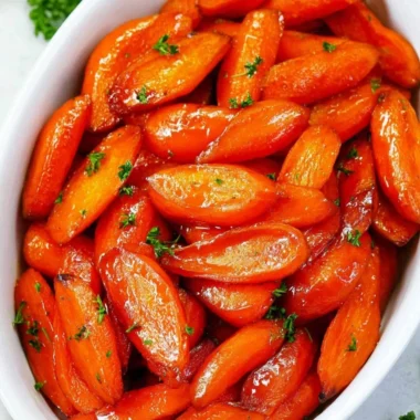 Delicious brown sugar glazed carrots served on a plate, a perfect side dish.