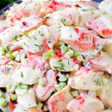 Fresh crab salad with vegetables and dressing in a bowl