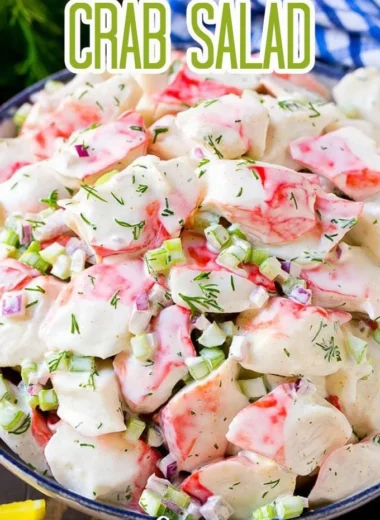 Fresh crab salad with vegetables and dressing in a bowl