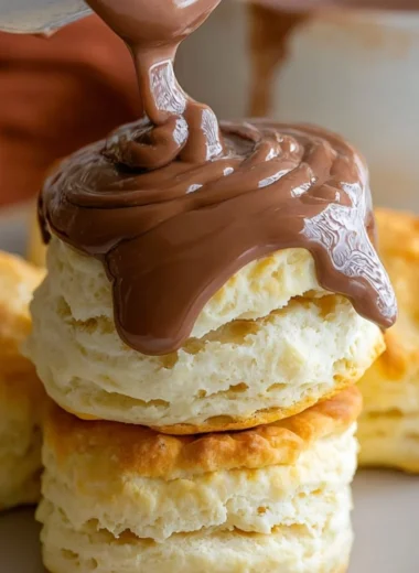 Creamy Southern chocolate biscuit gravy served in a bowl, drizzled with chocolate sauce.
