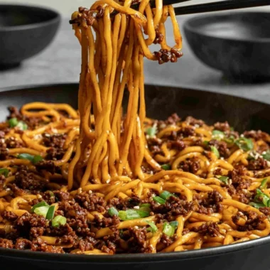 Easy Mongolian ground beef noodles dish with vegetables and sauce.