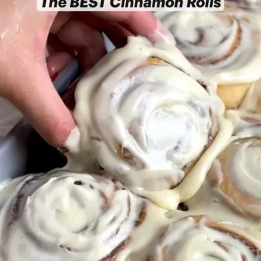 Freshly baked homemade cinnamon rolls topped with icing.