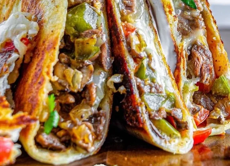 Philly Cheesesteak Quesadilla with melted cheese and finely chopped steak.