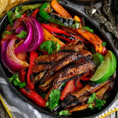 Portobello vegan fajitas served with colorful peppers and onions