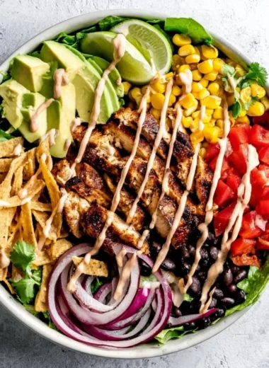 Bowl of Spicy Southwest Avocado Chicken Salad with colorful ingredients