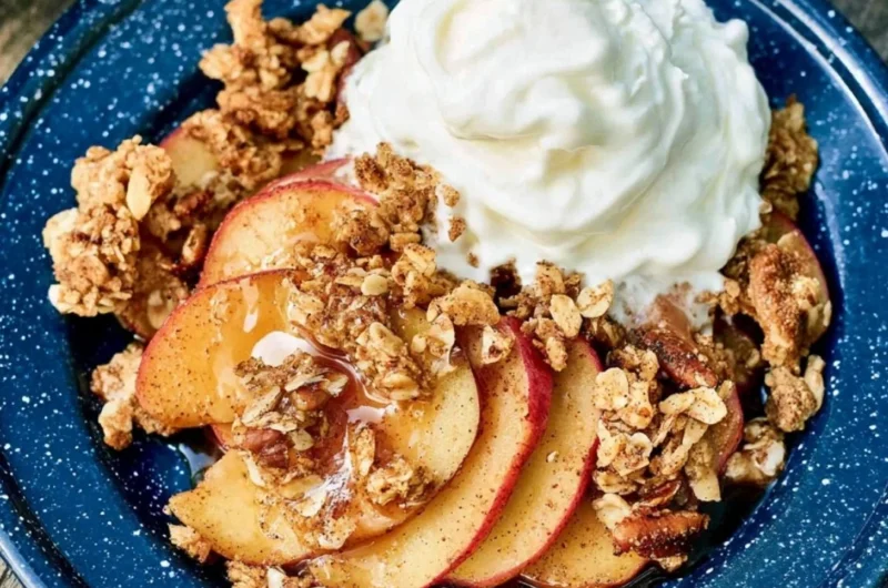 Vegan Campfire Apple Crisp with fresh apples and crispy topping over a campfire