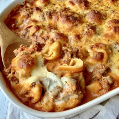 Cozy cheesy baked tortellini casserole served in a rustic dish