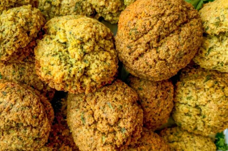 Plate of cozy homemade falafel with fresh vegetables and dipping sauce