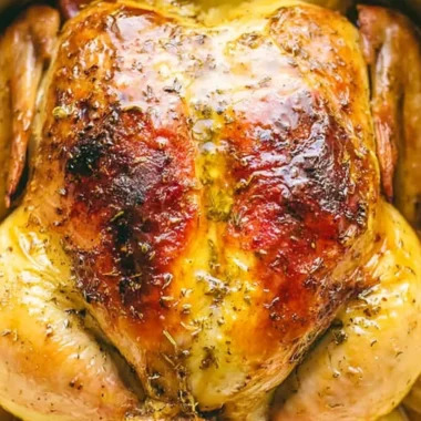 Deliciously cooked whole chicken in a Dutch oven, perfect for family meals.