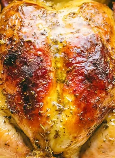 Deliciously cooked whole chicken in a Dutch oven, perfect for family meals.