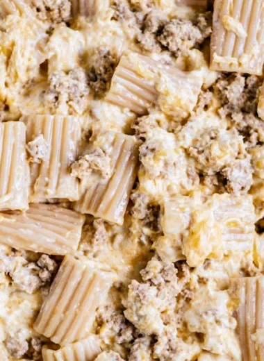 A creamy bowl of homemade cheeseburger pasta topped with cheese and herbs.