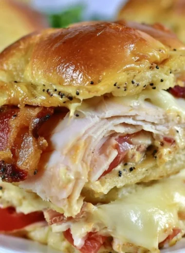 Kentucky Hot Brown Sliders with turkey and cheese on a platter