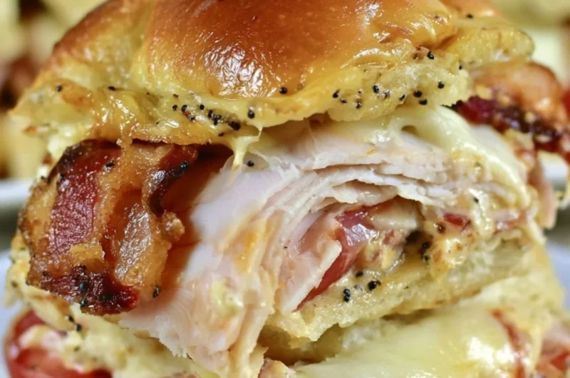Kentucky Hot Brown Sliders with turkey and cheese on a platter