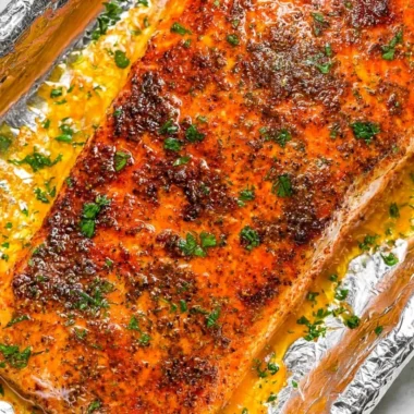 Oven baked salmon served with vegetables on a plate