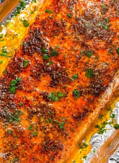 Oven baked salmon served with vegetables on a plate