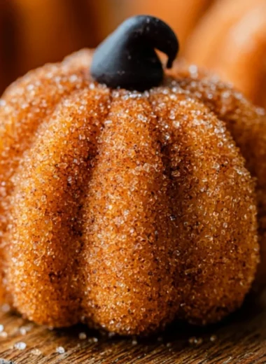 Delicious Pumpkin Cheesecake Truffles on a plate, perfect for fall desserts.