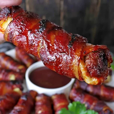 Delicious smoked shotgun shells on a platter, perfect for grilling enthusiasts.
