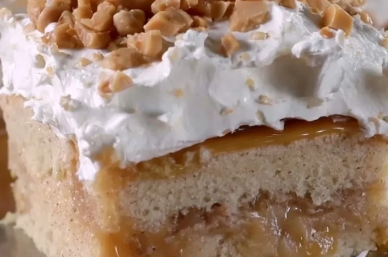 Delicious Caramel Apple Poke Cake with caramel drizzle and apple slices