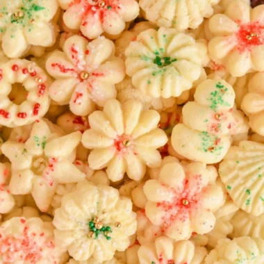 Delicious buttery spritz cookies arranged on a festive plate.