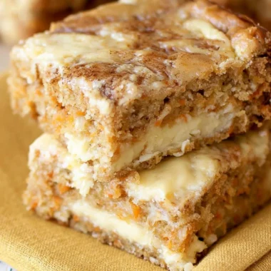 Delicious cozy carrot cake bars topped with cream cheese frosting