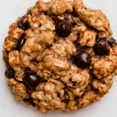 Cozy chocolate chip banana oatmeal cookies on a wooden table