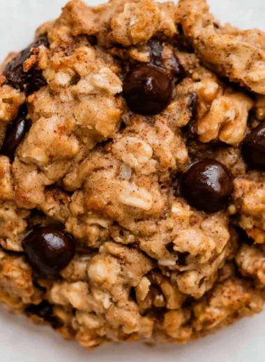 Cozy chocolate chip banana oatmeal cookies on a wooden table