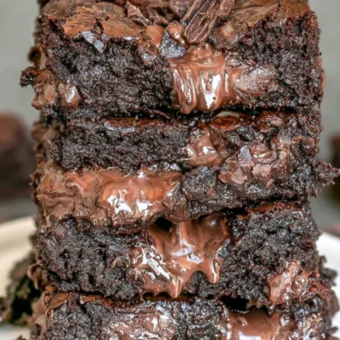 Delicious cozy fudge brownies on a rustic plate for guilt-free indulgence