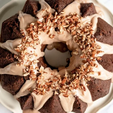 Cozy gingerbread bundt cake drizzled with maple cinnamon glaze