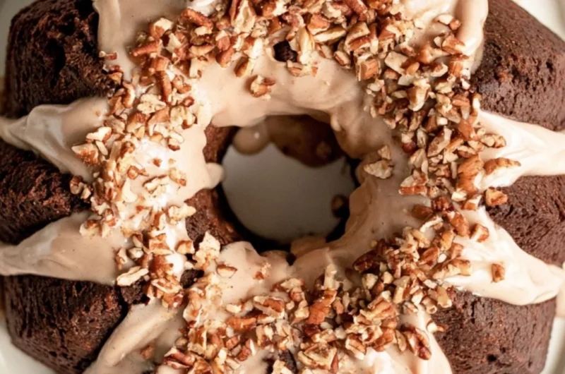 Cozy gingerbread bundt cake drizzled with maple cinnamon glaze