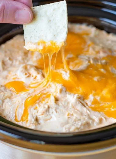 Creamy Maryland crab dip served with crispy crackers and fresh herbs
