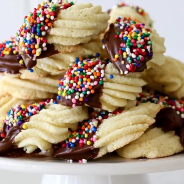 Delicious Italian Spritz Cookies arranged on a decorative plate.