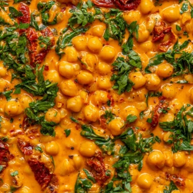 Delicious Marry Me Chickpeas served in a bowl with fresh herbs